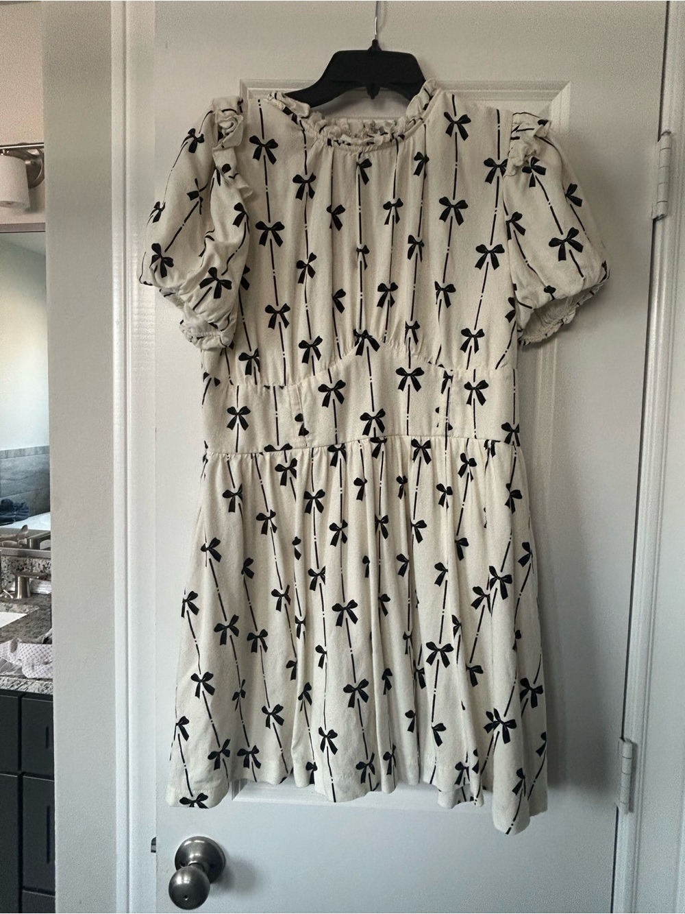 Francesca's Collections Cream Dress with Black Bow Print